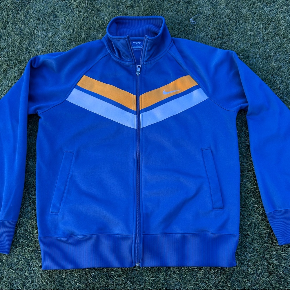 Nike Men's Blue Windbreaker with Orange and White Stripes